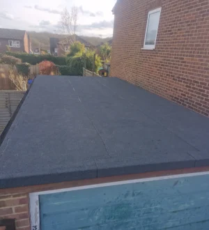 Emergency Flat Roof Repairs oofing specialist sealing leak on asphalt flat roof in London
