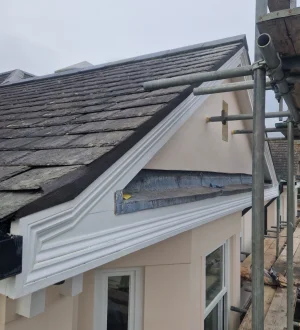 Preventive Roof Maintenance Roofing technician inspecting tiles and checking for damage during routine maintenance